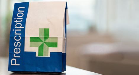 NHS prescription bag on a counter